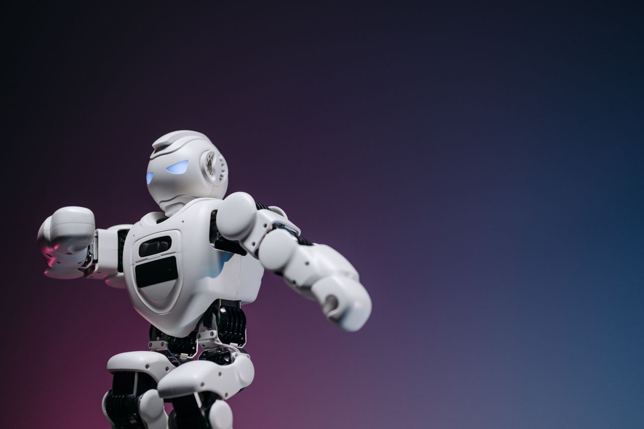 Crafting Captivating Headlines: Your awesome post title goes here Close-up of a futuristic robotic toy against a gradient background, symbolizing innovation and technology.